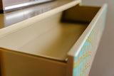 KAWOLA Highboard LAGO 5 Schubladen Glas grün Fuß Edelstahl goldfarben